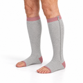 Open-toe zip-on compression socks in grey with a pink top band and heel