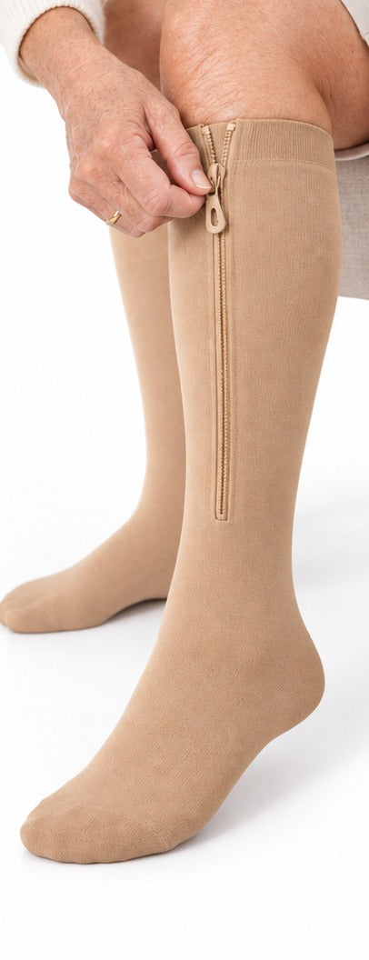 Step 3: pulling the big zip tab up the calf
